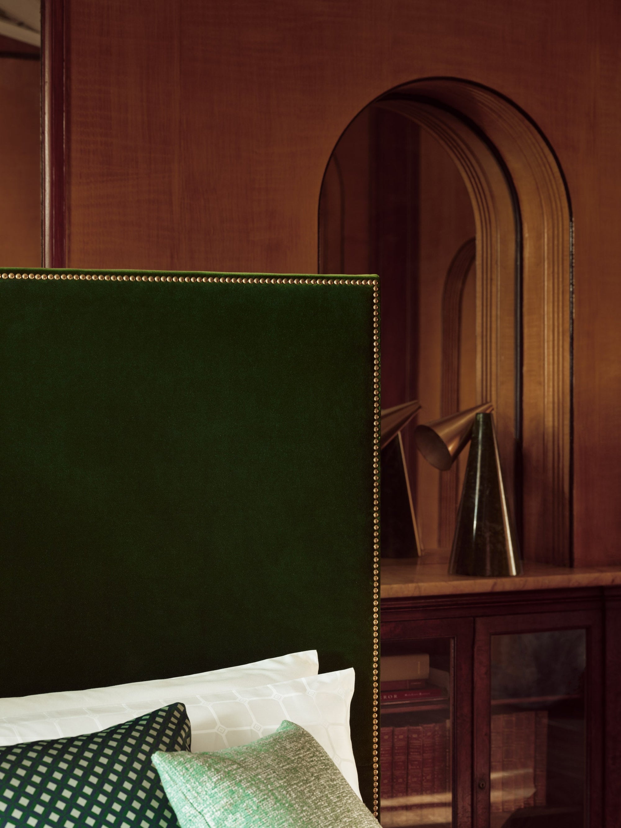 The Harlech bed with a green headboard