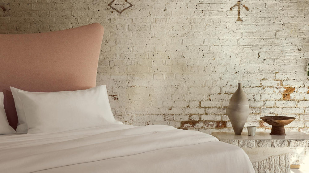 Amelia handmade bed with a salmon pink headboard