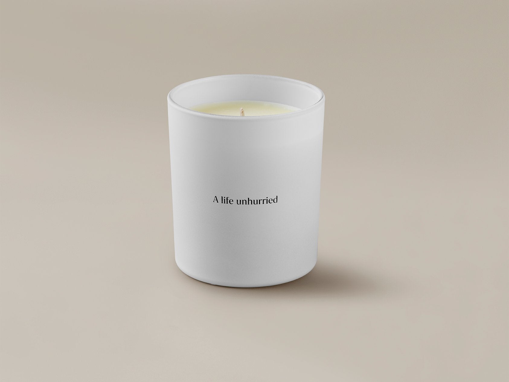 Savoir candle with ''A life unhurried'' written at the back