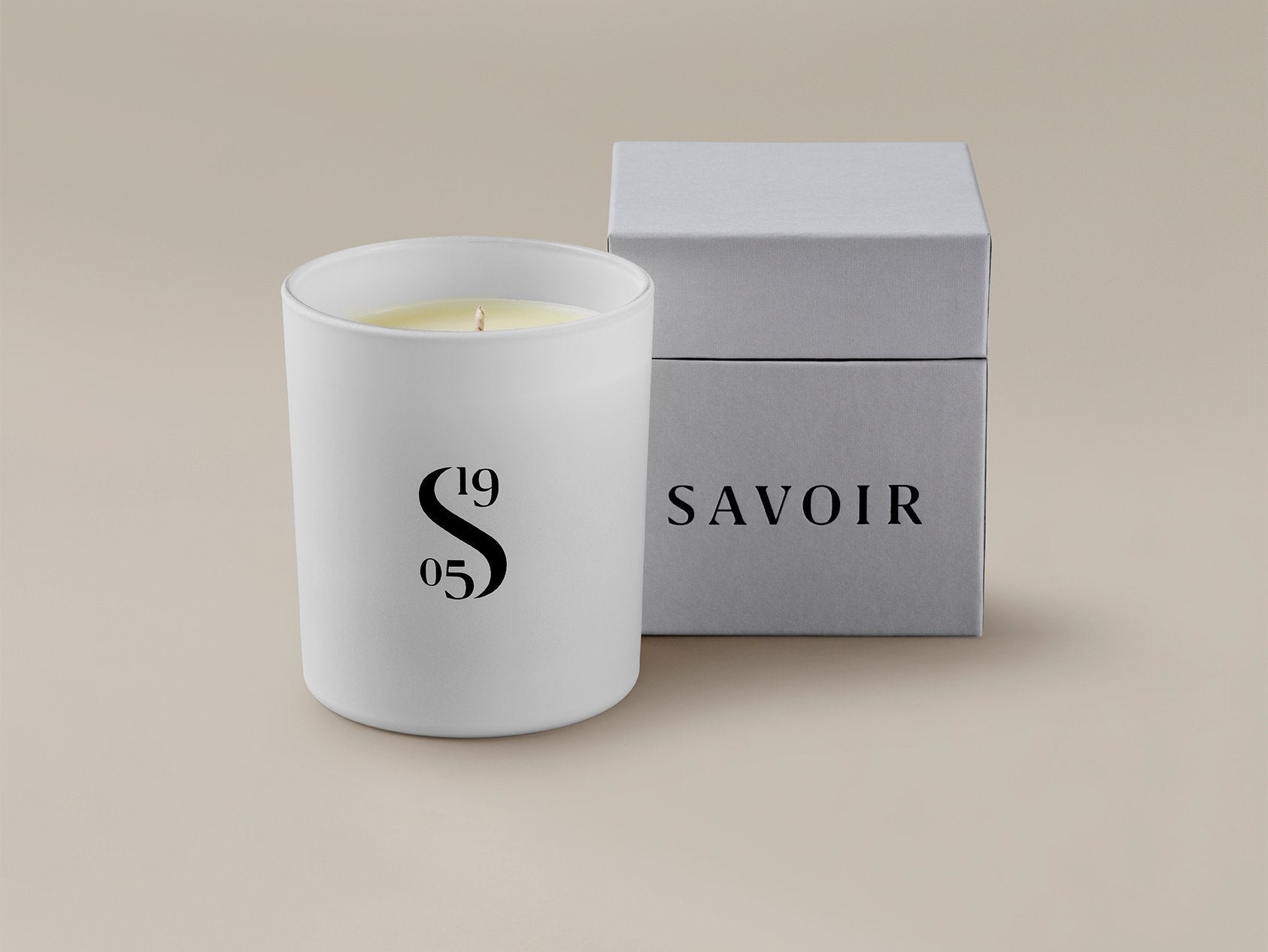 Savoir candle with the box behind it
