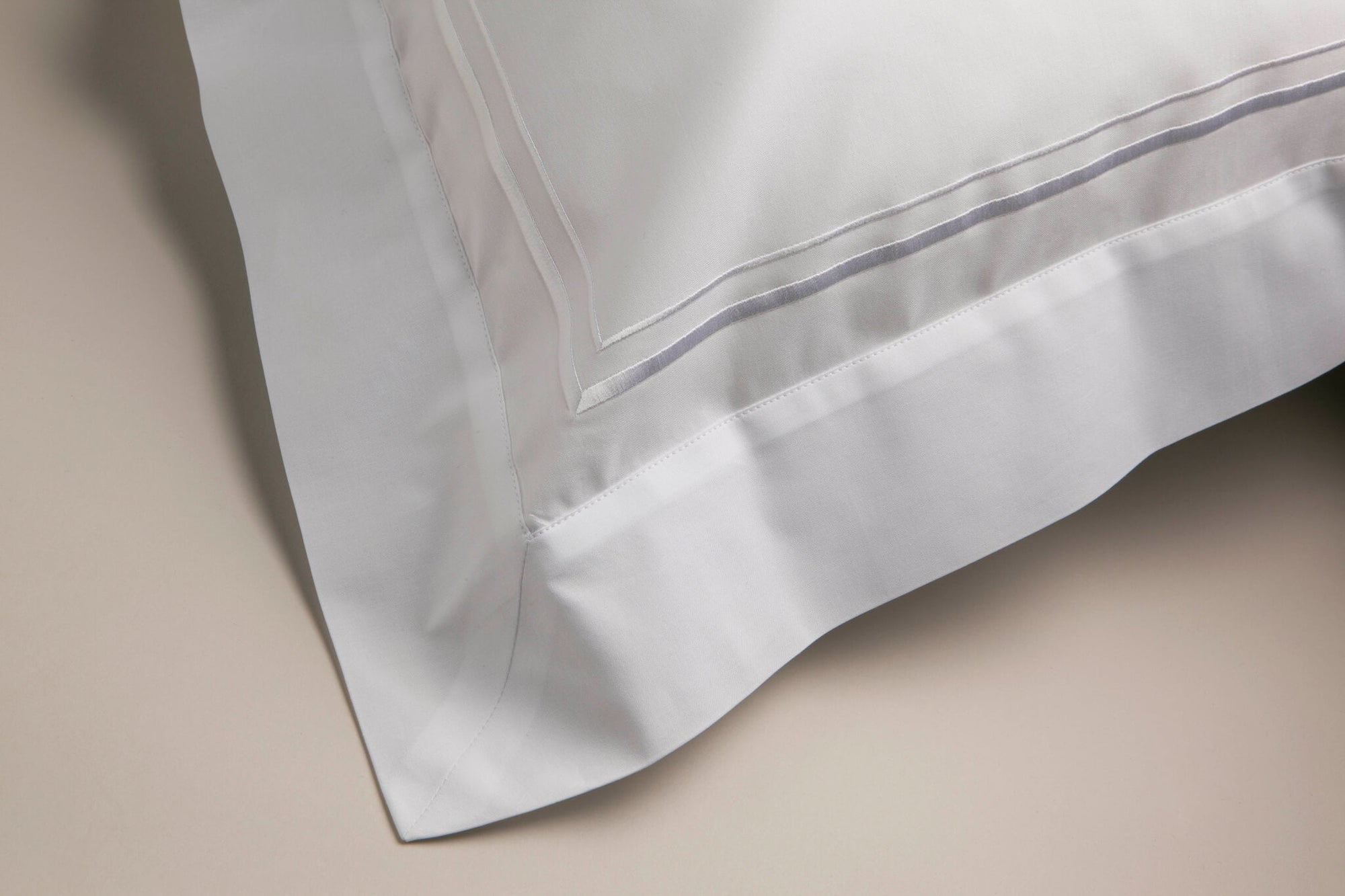 Corner view of Oxford pillowcase and white cording