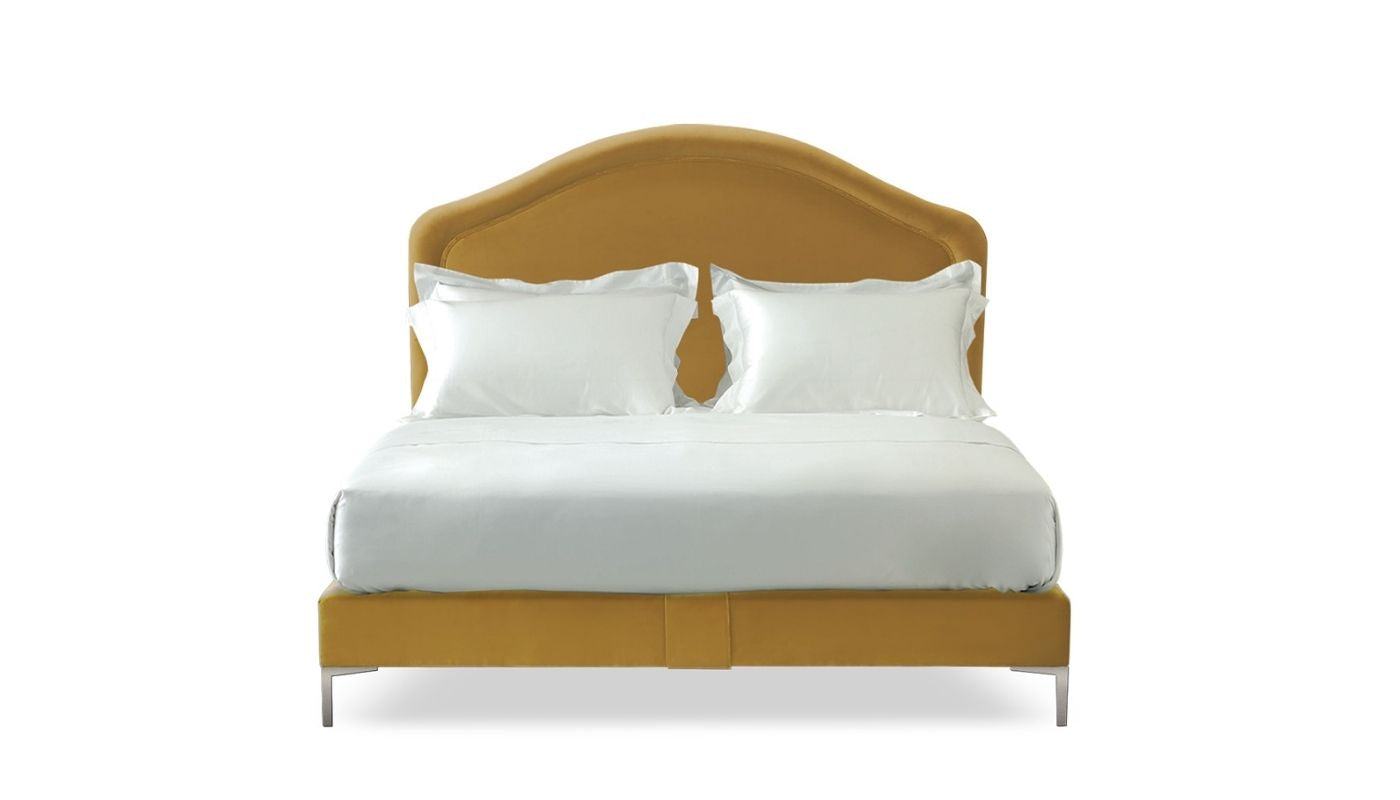 Undressed Cassie bed with a mustard fabric on headboard and base, featuring cushions