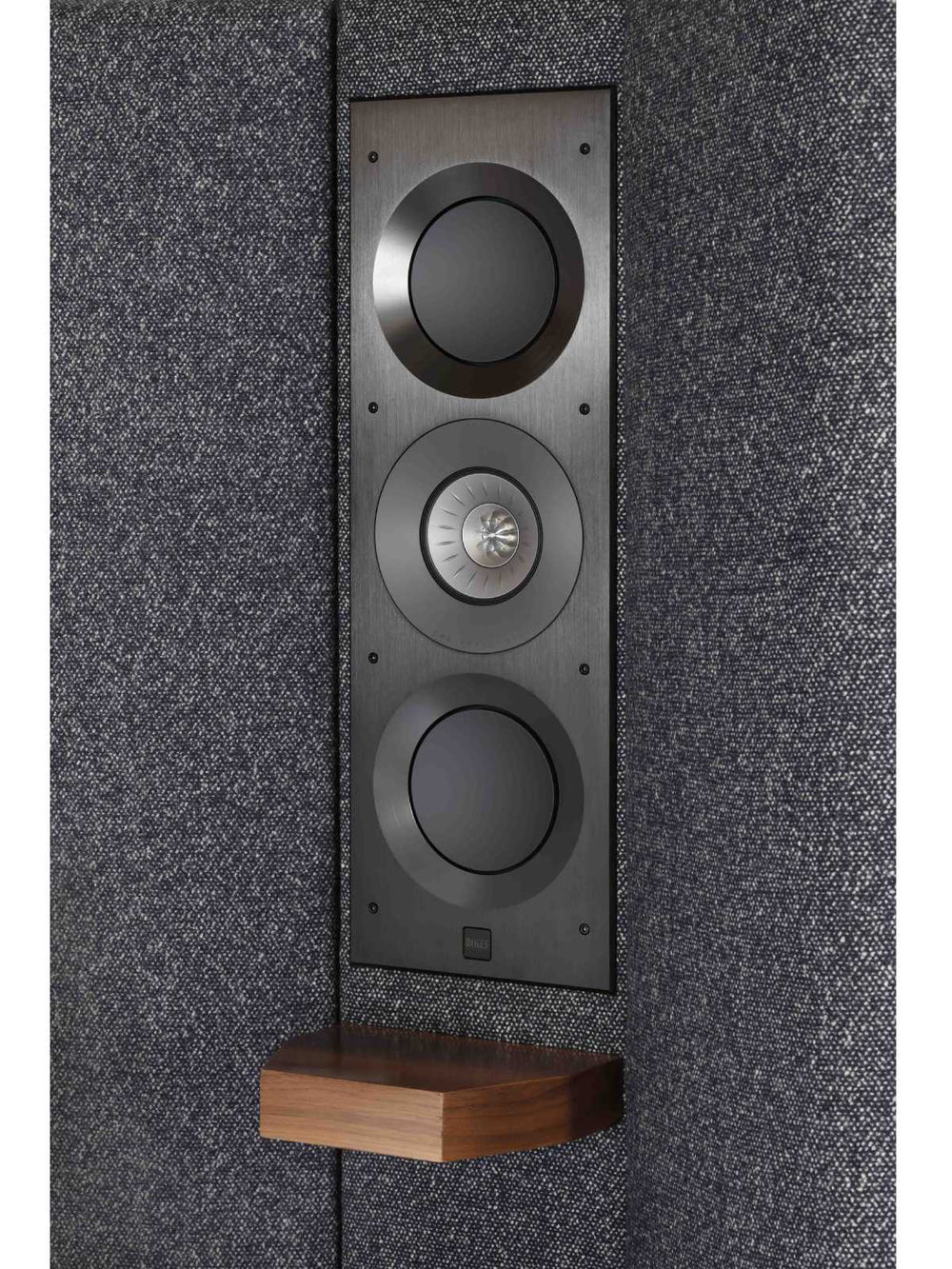 The architectural speaker by KEF seamlessly integrated into the headboard of the Seventy Five design.