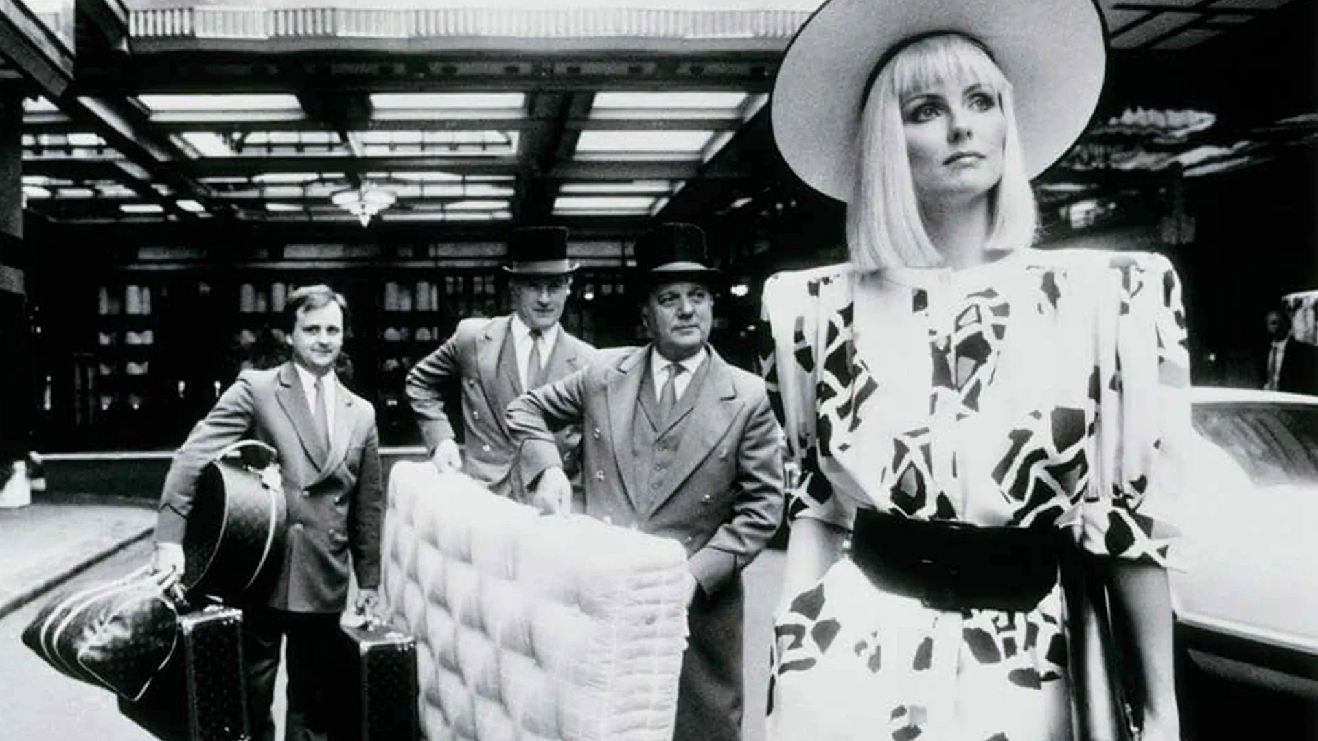 Savoy hotel employee carrying a Savoir mattress