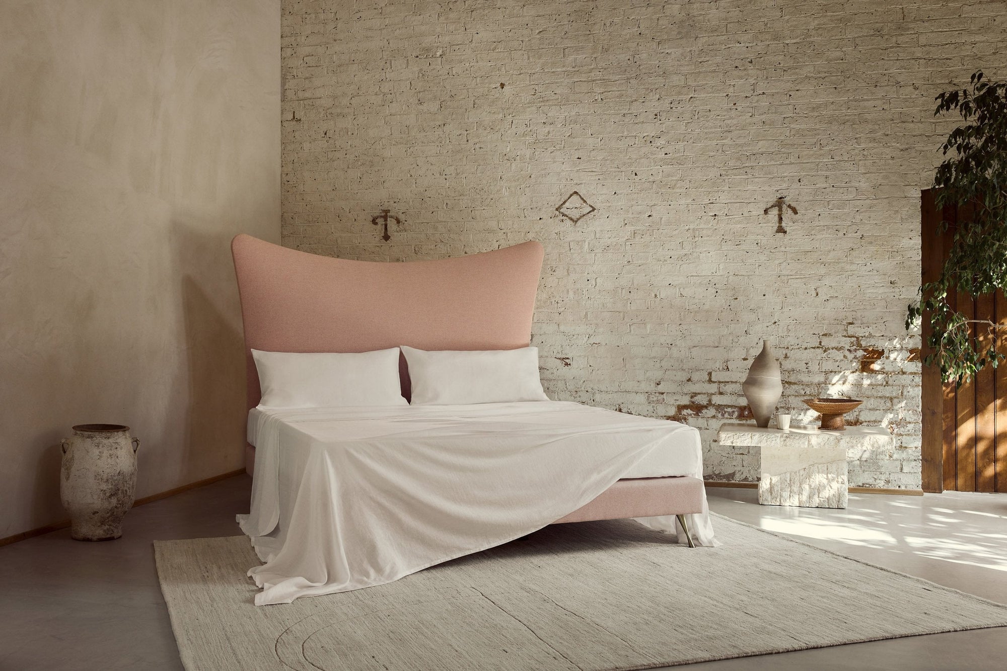 Savoir's 100% Organic Linen Flat Sheet draped over a bed
