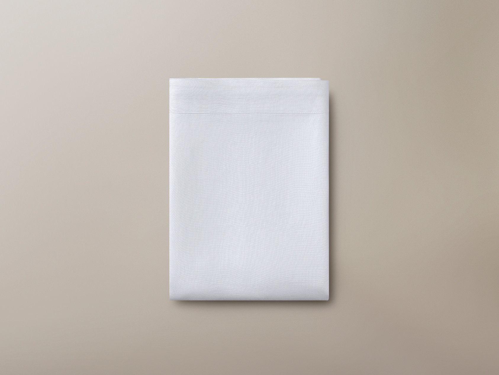 Top view of a folded Savoir organic linen flat sheet
