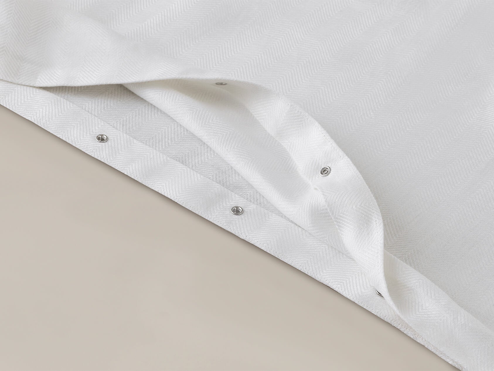 Duvet closure detail for Savoir's white herringbone bed linen