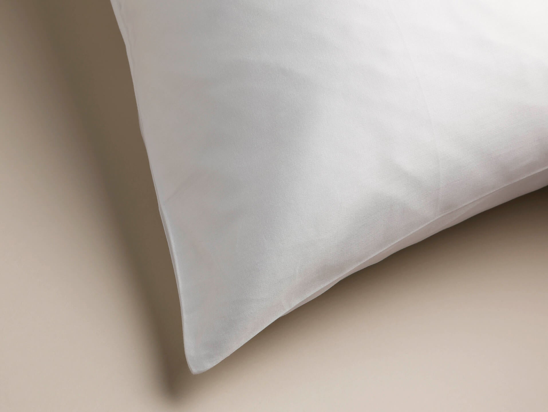 View from an angle of a Cambridge pillowcase with sateen detail