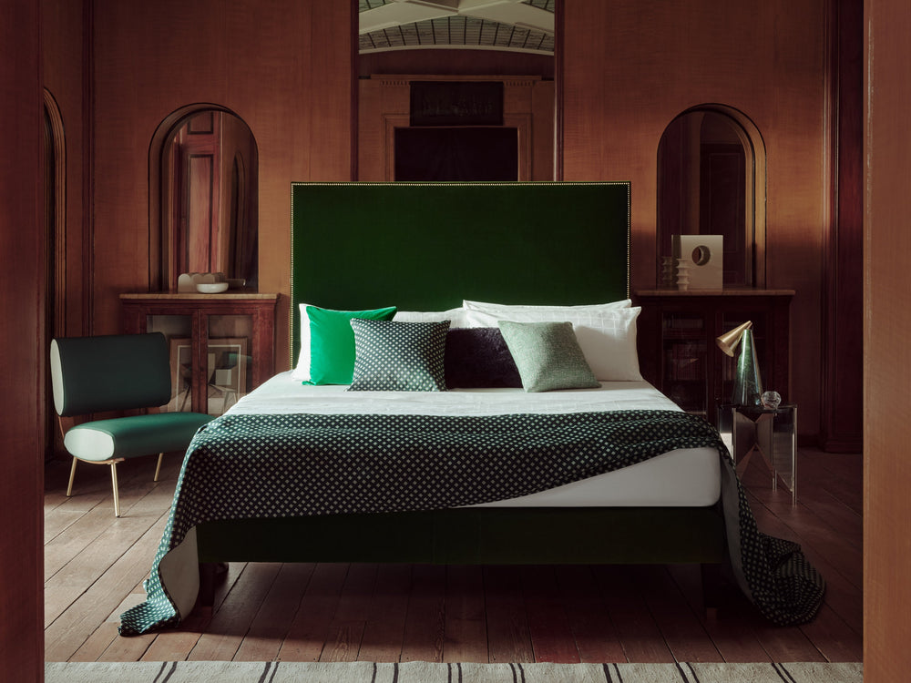 Landscape view of the Harlech bed with a green headboard