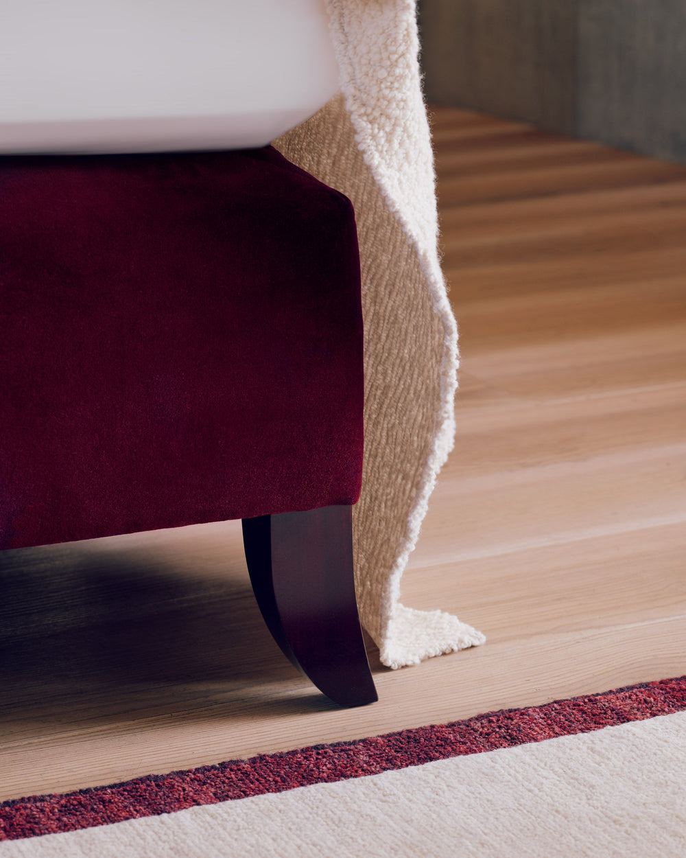 Close-up of one of Savoir Elly's legs with a Rosewood finish.
