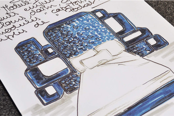 A drawing of the B bed with a blue headboard